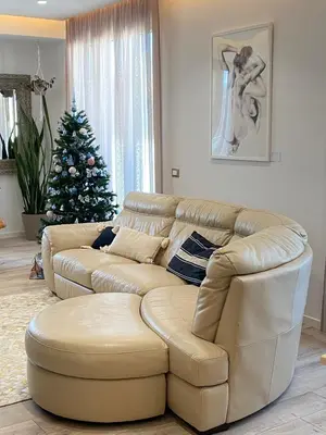 a living room with a couch and a christmas tree at Dimora D'aumale in Palermo