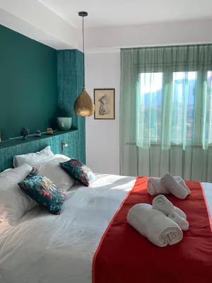 a bedroom with a large bed with towels on it at Dimora D'aumale in Palermo