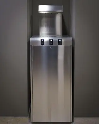 a silver refrigerator with a container on top of it at Hostelò - Luxury Hostel in Palermo