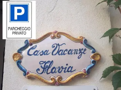 a sign on the side of a building at Casa Vacanze Flavia in Palermo