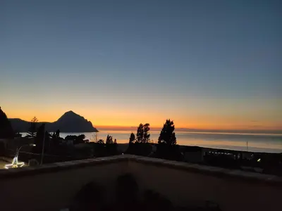 a sunset seen from the roof of a building at Kalura B&B in Macari