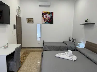a bathroom with a shower with a tiled shower at La Rondine Bed in Ficarazzi
