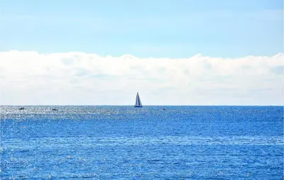 a sail boat in the middle of the ocean at 2 Bedroom Awesome Apartment In Trappeto in Trappeto