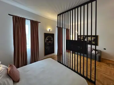 a bedroom with a bed and a window at Giglio luxury apartment in casa professa in Palermo