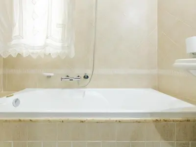 a white bath tub in a bathroom with a window at Holiday Home Perla by Interhome in Partinico