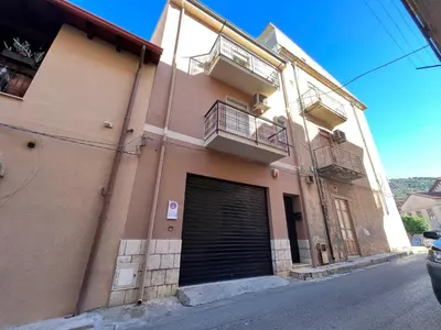 a building with a door and a garage at Holiday Home Perla by Interhome in Partinico