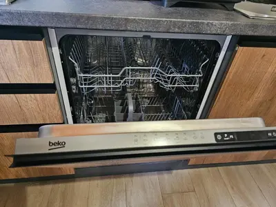 a dishwasher with the door open in a kitchen at Appartamento Vista Stazione in Palermo