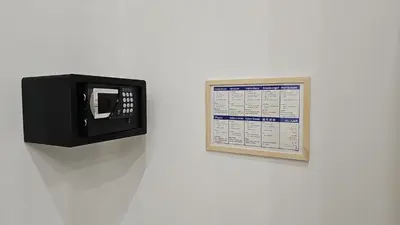 a calendar hanging on a wall next to a clock at Appartamento Vista Stazione in Palermo