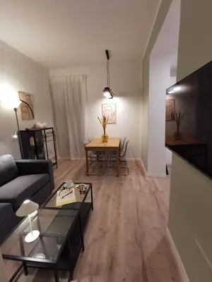 a living room with a couch and a table at Casarino House Luxury Apartment in Palermo