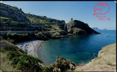a view of a beach and the water with boats in it at Villa CLARA in Altavilla Milicia