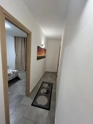 a hallway with a door leading to a bedroom at Ciccio's House in Palermo