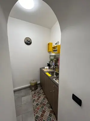 a kitchen with a sink and a counter top at Ciccio's House in Palermo
