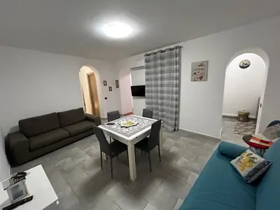 a living room with a couch and a table at Ciccio's House in Palermo