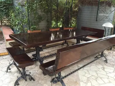 a ping pong table and a bench in a yard at CASE VACANZA PERLA DEL SUD in San Vito lo Capo