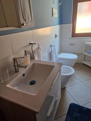 a bathroom with a sink and a toilet at Dome Suite La Cupoletta in Palermo