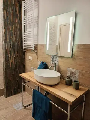 a bathroom with a sink and a mirror at Palermo case vacanza in Palermo