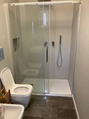 a bathroom with a shower with a toilet and a sink at Casa levante in Palermo