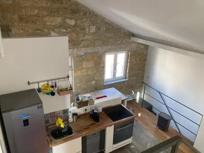 an overhead view of a kitchen with a stone wall at Casa levante in Palermo
