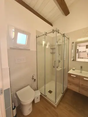 a bedroom with a large bed and a large window at Antò 2.0 in Castellammare del Golfo