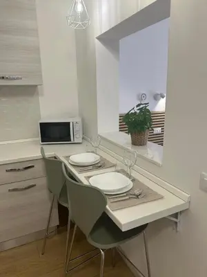 a small room with a bed and a kitchen at Antò 2.0 in Castellammare del Golfo