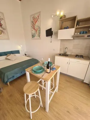 a bathroom with a washing machine and a sink at Antò 2.0 in Castellammare del Golfo