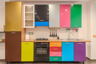 a colorful kitchen with colorful cabinets at Casetta dei Colori - Apartament in Palermo
