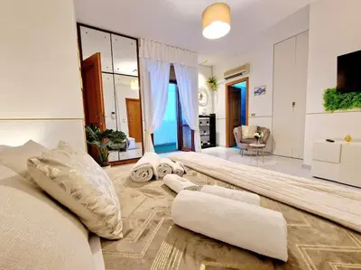 a bedroom with a bed and pillows on the floor at Politeama Dependance in Palermo