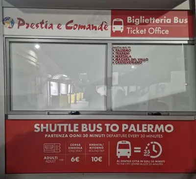 a bus stop with a sign on the side of it at Politeama Dependance in Palermo