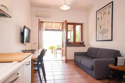 a living room with a couch and a table at Casa Za Lisa con Vista Mare a Macari in Macari