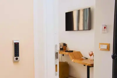 a door leading into a room with a desk at Suites Cavour holiday dream in Palermo