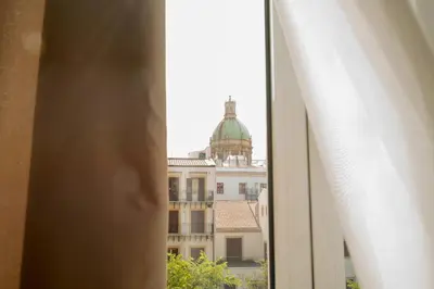 a view of a building from a window at Suites Cavour holiday dream in Palermo