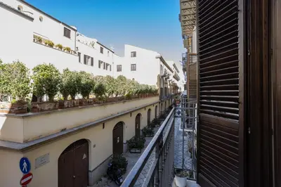 a view from a balcony of a street with buildings at Hola House alla Magione in Palermo