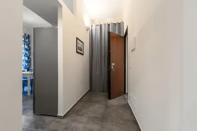 an open door in a room with a hallway at Palazzo Falcone Apartments in Palermo