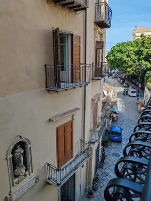 a view of a building with balconies and a street at Lily Apartments in Palermo