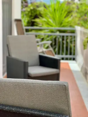 a close up of a bench on a balcony at La casa di Gisa&Laura Lido di Mondello spiaggia in Palermo