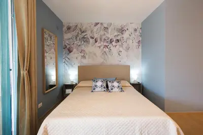 a bedroom with a bed with two pillows on it at Casa vacanze near airport in Cinisi