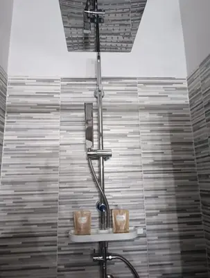 a shower in a bathroom with a shower head at Lannari 176 Casa vacanze Bagheria in Bagheria