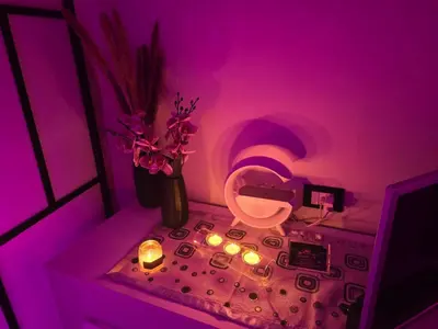a purple room with a toilet and flowers and candles at Lannari 176 Casa vacanze Bagheria in Bagheria