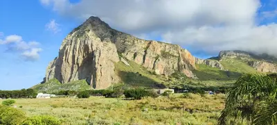 a large mountain in the middle of a field at Villa Indipendente Tranquillità e Relax in San Vito lo Capo