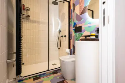 a bathroom with a toilet and a shower at Casa Alexandra - Luxury & Design in Castellammare del Golfo