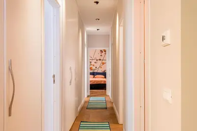a hallway with colorful rugs on the floor at Casa Alexandra - Luxury & Design in Castellammare del Golfo