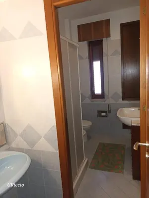a bathroom with a sink and a toilet at Casa Riccio in Palermo