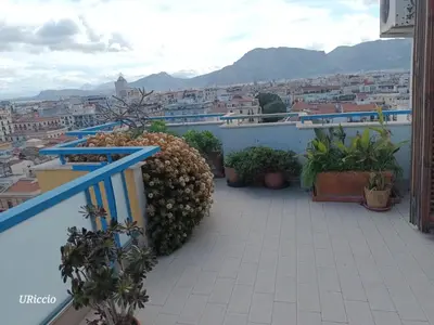 a balcony with a view of a city at Casa Riccio in Palermo
