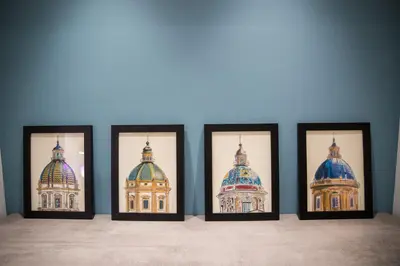 four framed photos of the domes of a building at Maison La Lumia in Palermo