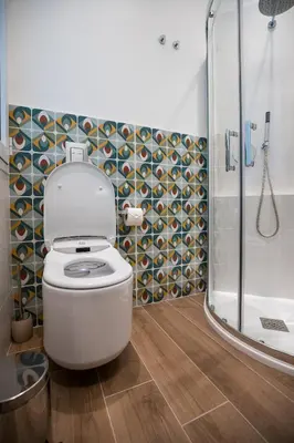 a bathroom with a toilet and a shower at Maison La Lumia in Palermo
