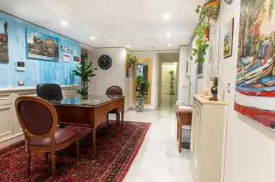 a dining room with a table and chairs at Federico 70 Acquamarina Luxury in Palermo