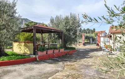 a garden with a pavilion in a yard at Lovely Home In Altavilla Milicia in Altavilla Milicia