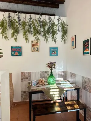 a room with a table with a vase on it at Lilla' House Center Palermo in Palermo