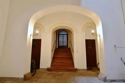 a hallway with a staircase in a building at La Locanda dei Corrieri in Palermo