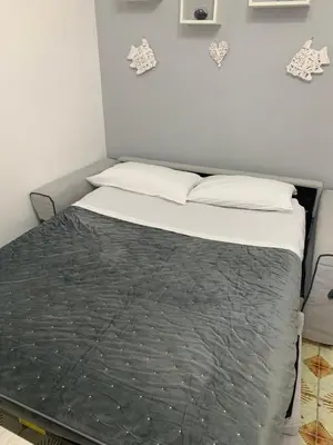 a bed in a room with two pillows at casa giorgia mondello in Palermo